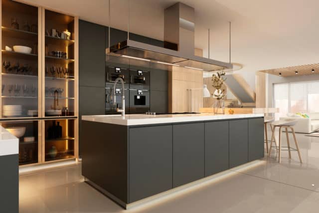 Intérieur d'une cuisine moderne avec îlot central dans des couleurs sombres - Architecture d'intérieur à Annecy et en Haute-Savoie (ArchiBienPensé)